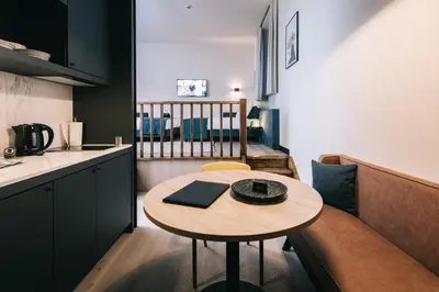 a small kitchen with a table in a room at Getaway Gent in Ghent