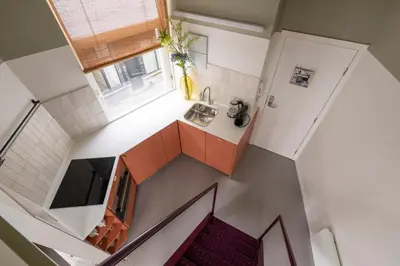 an overhead view of a small kitchen with a sink at SHWAY - The Black Pants in Antwerp