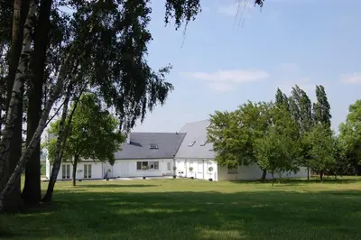 a white house with trees in front of it at No reservat till 20 febrBeautiful rooms at countryside Brussel in Halle