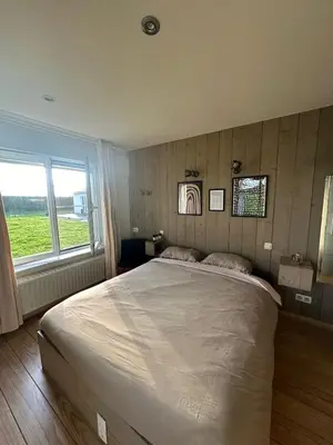 a bedroom with a large bed and a window at No reservat till 20 febrBeautiful rooms at countryside Brussel in Halle
