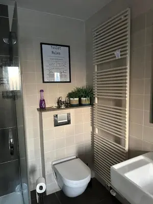 a bathroom with a toilet and a sink at No reservat till 20 febrBeautiful rooms at countryside Brussel in Halle
