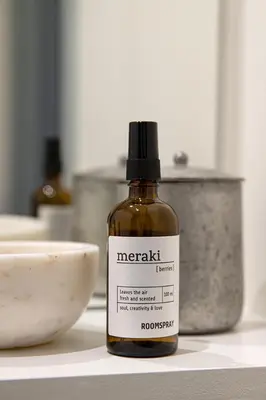 a bottle of vinegar sitting on a counter next to a bowl at Studio Spiegelhof in Ghent