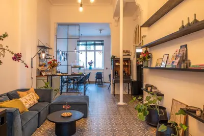 a living room with a couch and a table at B&B Achilles in Ghent