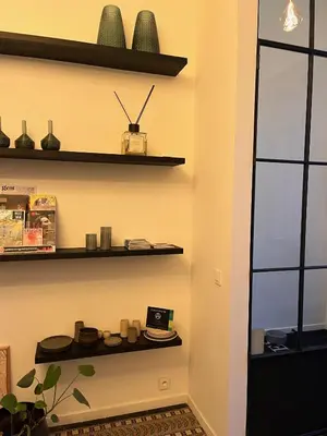 a room with shelves on the wall at B&B Achilles in Ghent