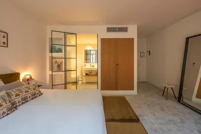 a bedroom with a large white bed in a room at B&B Achilles in Ghent