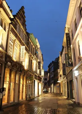 an empty street in a city at night at Bennestay in Ghent