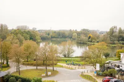 a view of a park with a lake at Résidence la floraison in Brussels