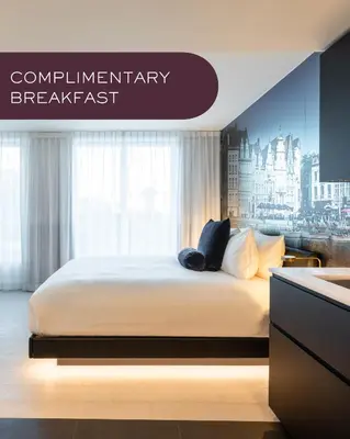 a bedroom with a white bed with aamicamicamicamicamicheasternheasternheastern at Residence Inn by Marriott Ghent in Ghent