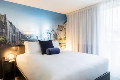 a bedroom with a large bed and a window at Residence Inn by Marriott Ghent in Ghent