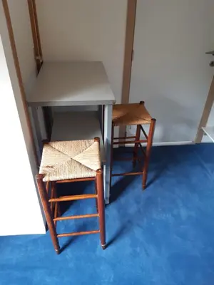 a table and two chairs sitting next to a table at Casa ENRICO in Antwerp
