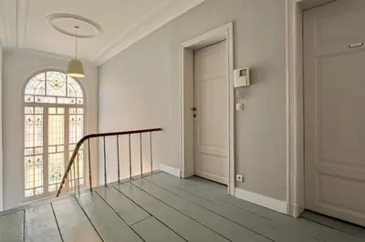 an empty hallway with a staircase and a door at Fish Market B&B in Brussels