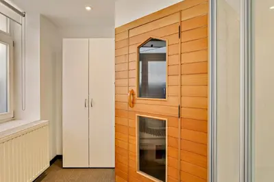 a room with a wooden door with a mirror at Fish Market B&B in Brussels