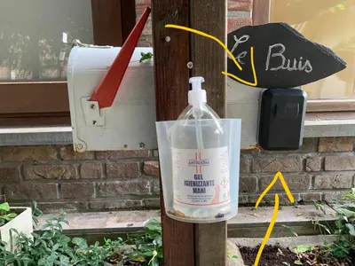 a bottle of detergent sitting next to a box at Le Buis in Genval