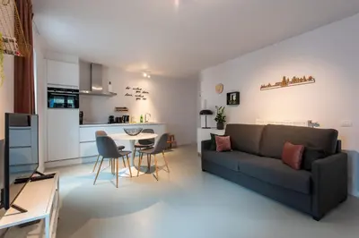 a living room with a couch and a table at Salt & Pepper Ghent in Ghent