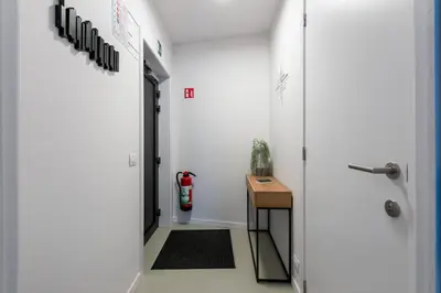 a hallway with a door leading into a room at Salt & Pepper Ghent in Ghent