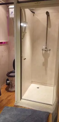 a glass shower door with a toilet in a room at Villa Blanco in Opwijk