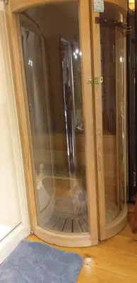 a glass door with a dog inside of it at Villa Blanco in Opwijk