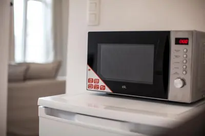 a microwave oven sitting on top of a counter at Luxury Suites Grotemarkt by Rikas Hotels in Antwerp