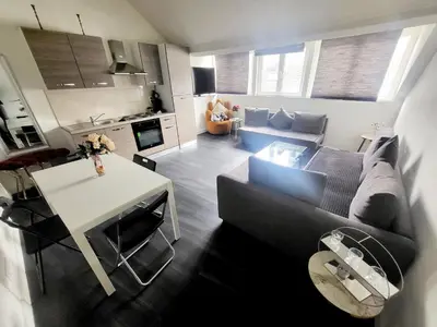 a living room with a couch and a table at City Brussels Apartments in Brussels