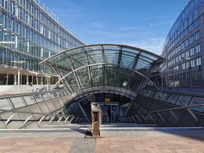a building with a spiral staircase in a city at Cosy Europarlament apartment in Brussels