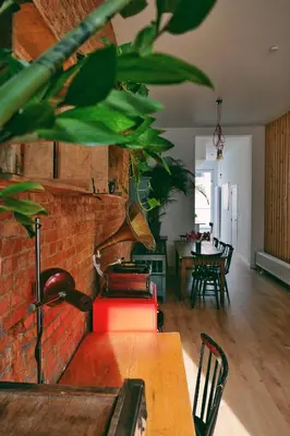 a living room with a brick wall and a table at 130sqm appartment with 20sqm terras and free parking in Antwerp