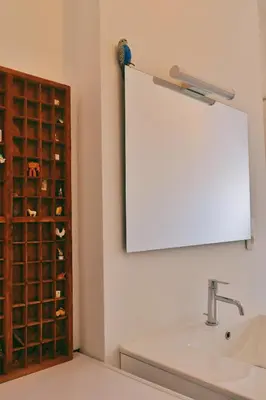 a bathroom with a sink and a wine rack at 130sqm appartment with 20sqm terras and free parking in Antwerp