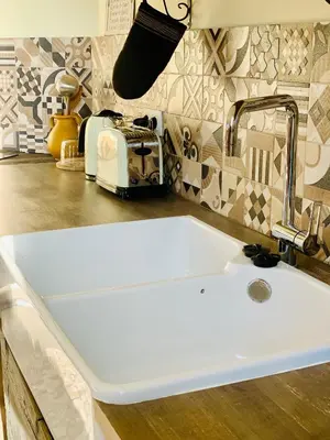 a kitchen counter with a sink and a toaster at SLEEP INN - 1001 Nights Loft Citycenter with Balconyview in Antwerp