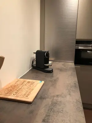 a kitchen with a cutting board on a counter at Entire House In Centre of Ghent in Ghent