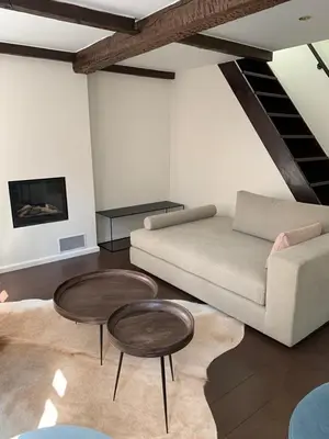 a living room with two tables and a couch at Entire House In Centre of Ghent in Ghent