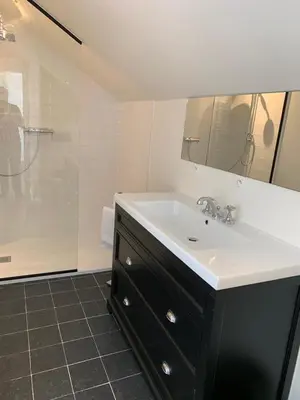a bathroom with a sink and a shower at Entire House In Centre of Ghent in Ghent