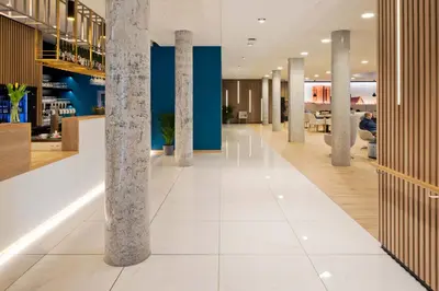 a lobby with columns in a building at Hotel Den Briel in Ghent