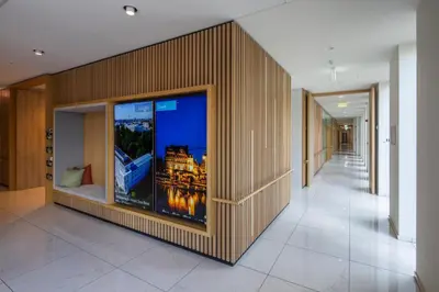 a hallway with a large window in a building at Hotel Den Briel in Ghent