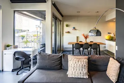 a living room with a couch and a table at London 993 Apt 202 in Antwerp