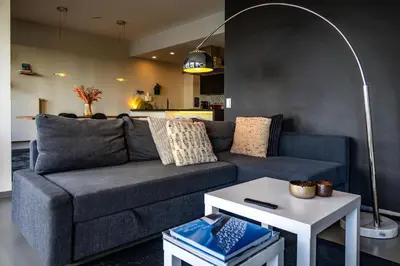 a living room with a couch and a table at London 993 Apt 202 in Antwerp