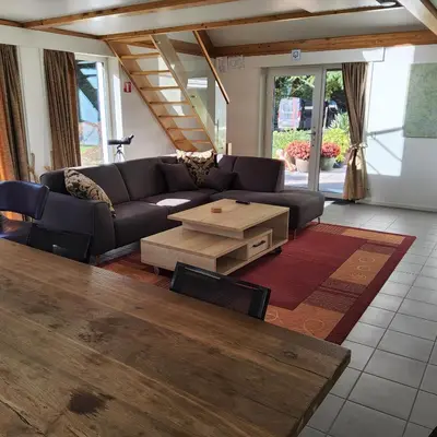 a living room with a couch and a coffee table at Kromven in Merksplas