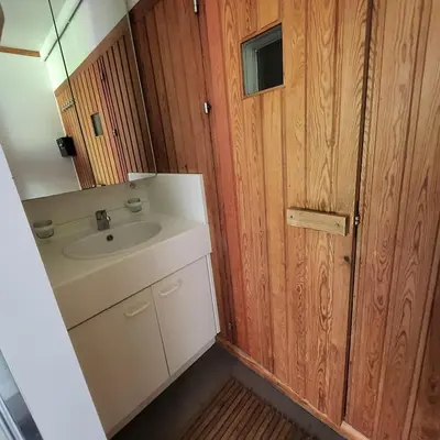 a small bathroom with a sink and a mirror at Kromven in Merksplas