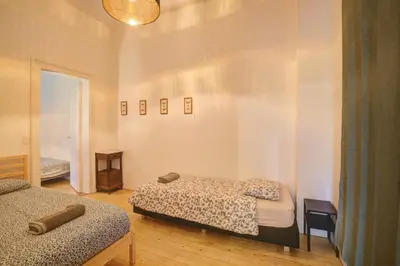 a bedroom with two beds in a room at Theodore Residence in the Heart of Antwerp in Antwerp