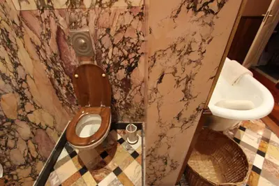 a bathroom with a toilet and a sink at B&B De Lachende Engel in Mechelen