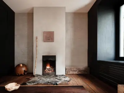 a living room with a fire place in the wall at Shelter 7 in Ghent
