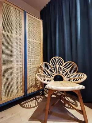 two chairs and a table in front of a curtain at SHWAY - The Pink Pigeon in Antwerp