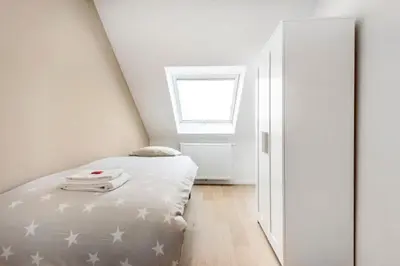 a small bedroom with a bed and a window at Design Loft near the city of Ghent in Ghent