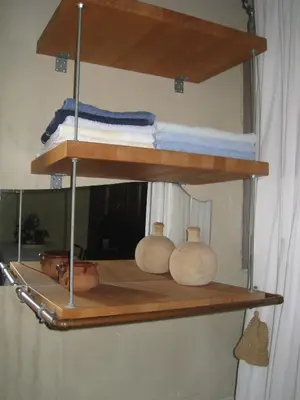 a shelf with towels and other items on it at Vakantiehuis in de velden met zwemvijver en Jeu de Boules baan in Lier