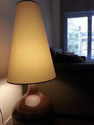 a lamp sitting on a table in a living room at Huis van Vletingen Apartment in Ghent