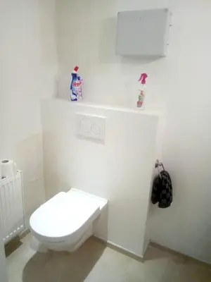a white bathroom with a white toilet in a room at Comfortable Apartment in Waterloo with Jacuzzi - 78m² in Waterloo