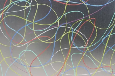 a bunch of multicolored wires on a wall at Brussels BnB in Brussels