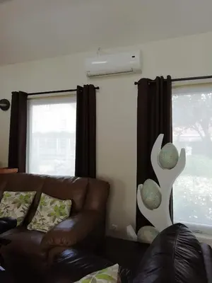 a living room with a couch and a window at The Mill 2380 in Ravels