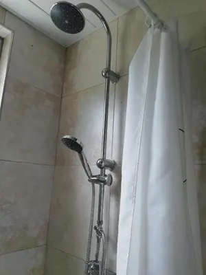 a shower in a bathroom with a shower curtain at The Mill 2380 in Ravels