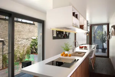 a kitchen with a white counter and a sink at B&B Snooz Inn in Ghent