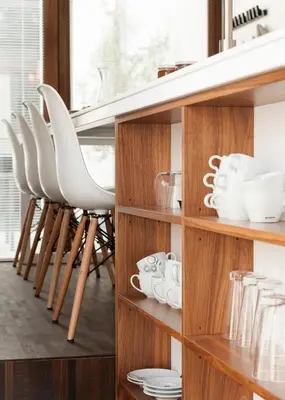 a row of white stools in a kitchen at B&B Snooz Inn in Ghent