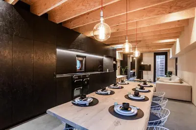 a room with a long table with dishes on it at Juno Boat in Ghent